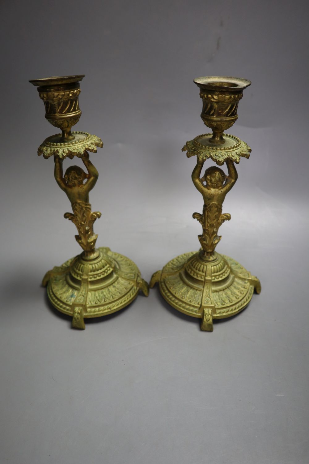 A pair of ormolu figural candlesticks, 20cm